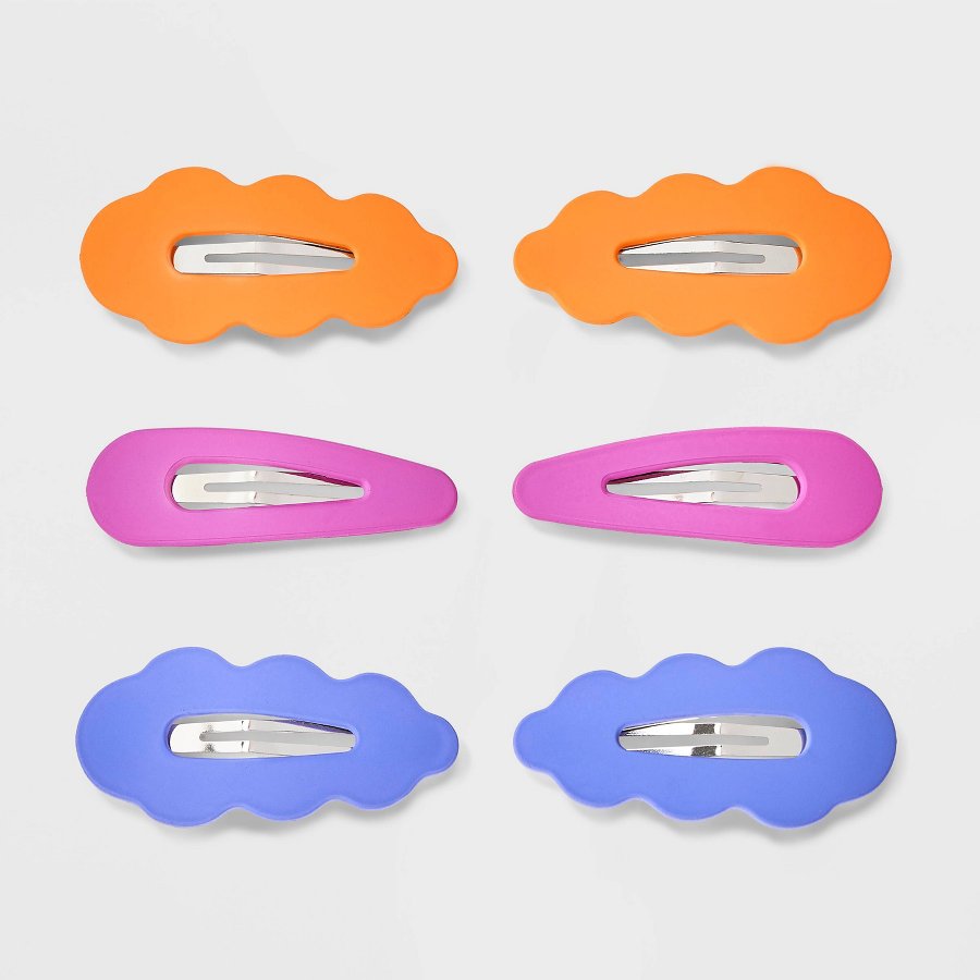 Six large soft-touch covered snap hair clips in pastel colors on a white background