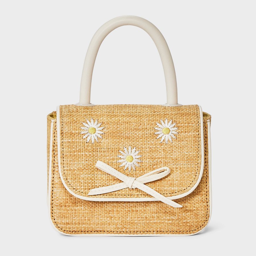 Small heather beige straw purse with daisy accent for toddlers on a white background