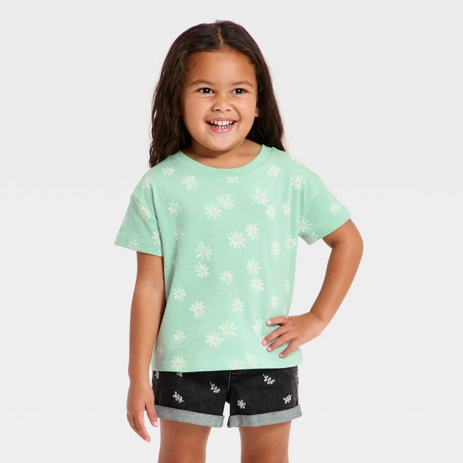 Cream Cat & Jack toddler tee with a small daisy print and a relaxed oversized fit