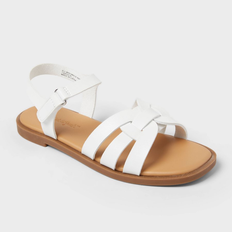 White kids sandal with H-shaped upper straps on a white background
