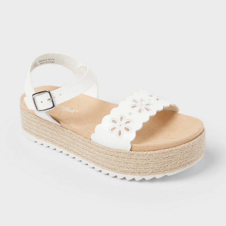White kids casual sandal with toe loop and ankle strap on a white background