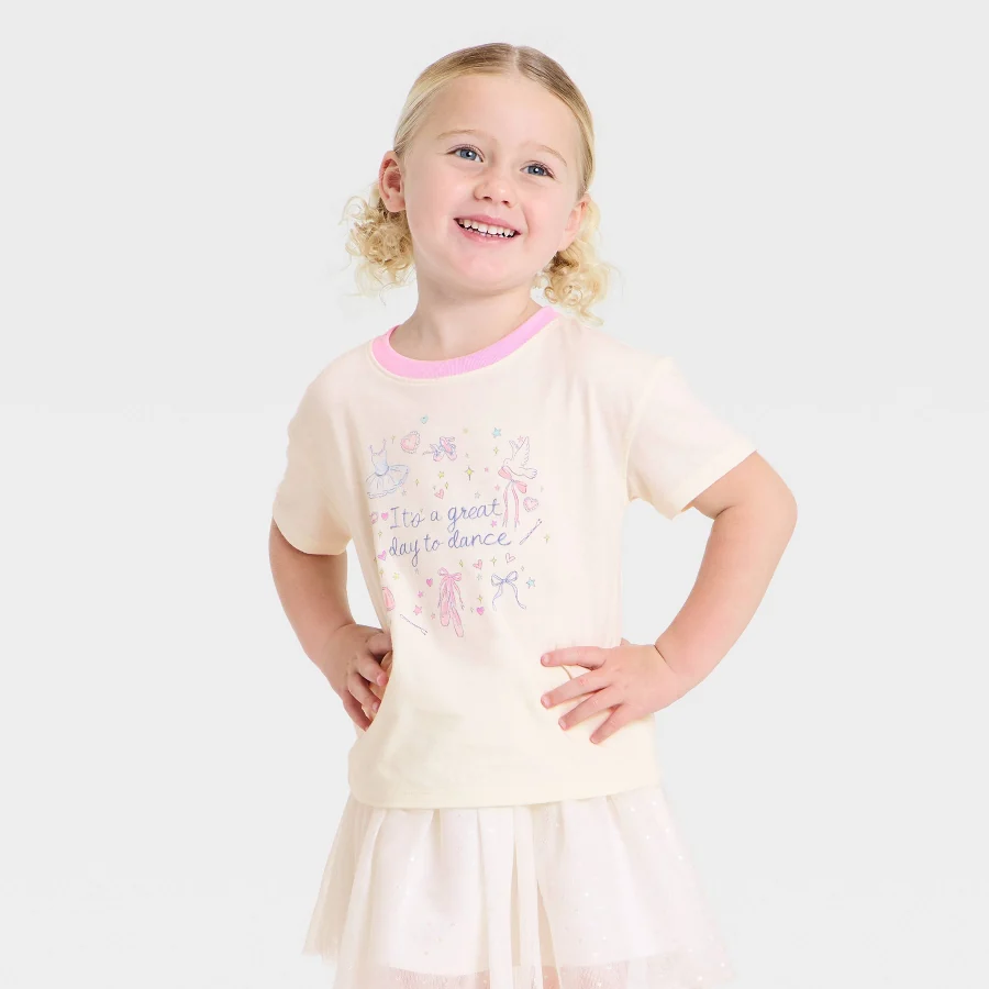 Light off-white toddler tee with a small front graphic