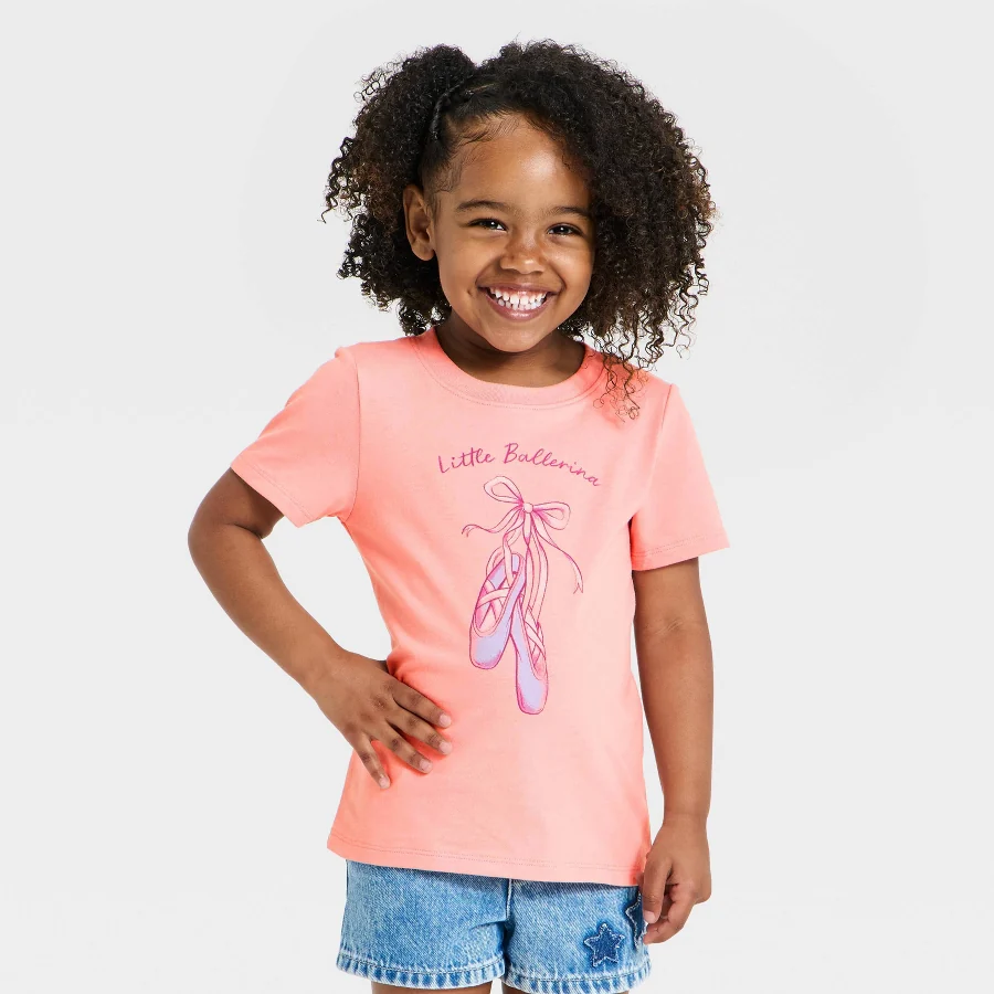 Pink toddler tee with a printed graphic on the chest