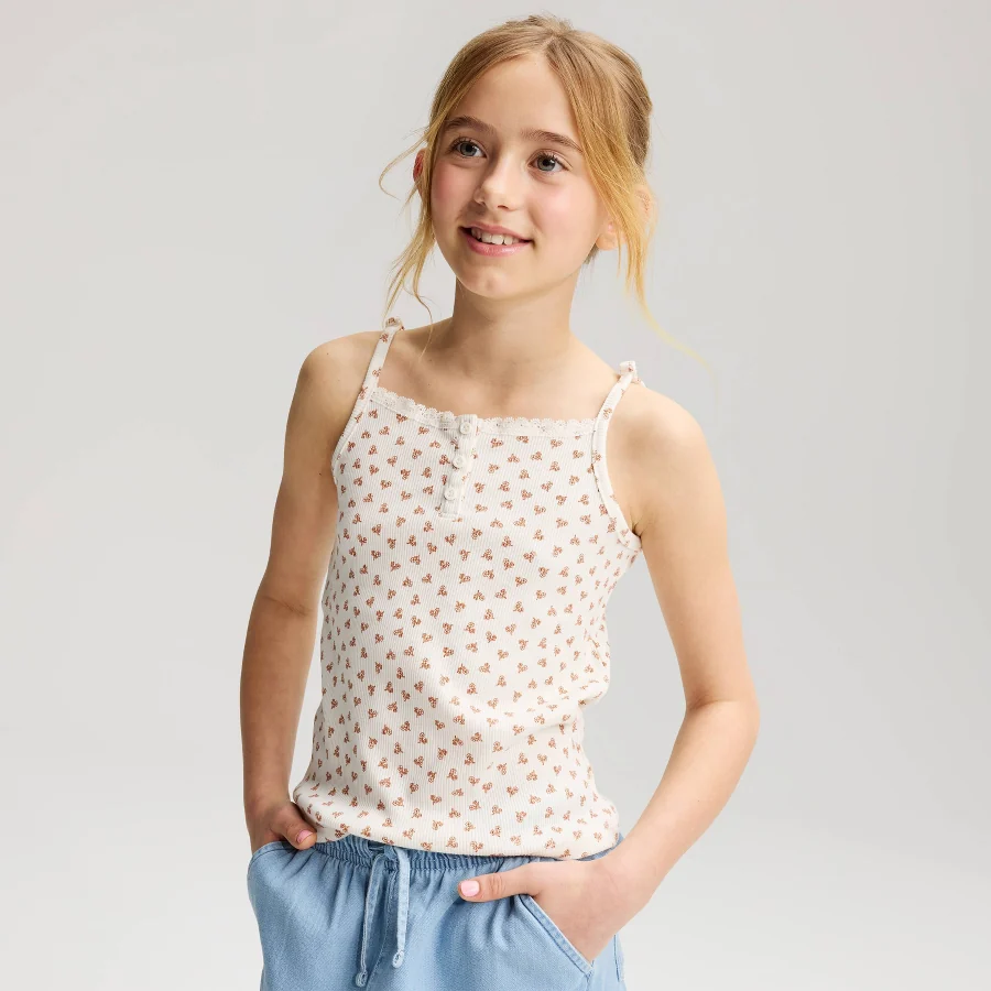 Sleeveless henley tank with lace trim along the neckline